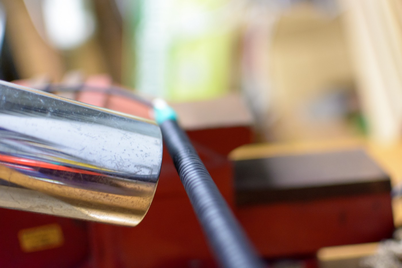 An image of the coiled cable from the previous image being heated by a hairdrier